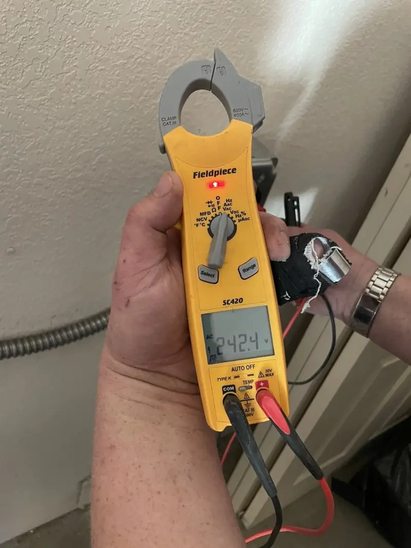 Voltage testing with clamp meter during Outlet Installation in Wendell